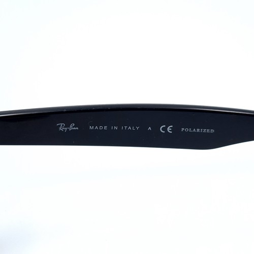 44 - A pair of genuine Ray-Ban sleek black framed sunglasses, featuring dark lenses. In good, clean condi... 