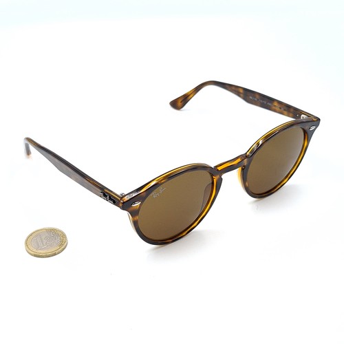 46 - A pair of stylish genuine Ray-Ban faux tortoiseshell framed sunglasses, featuring dark brown lenses.... 