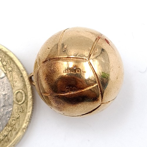 628 - A 9 carat gold Charm, in the form of football. Weight: 5.92 grams. Stamped 375.