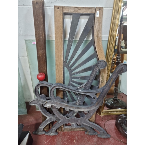 834 - A heavy cast metal two-seater garden bench. Featuring cast metal backrest and bench ends with four g... 