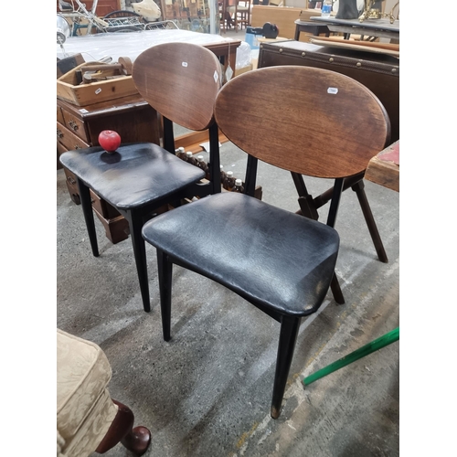 849 - A pair of Mid Century Modern  chairs by Beautility Furniture. Including a bentwood oval backrest and... 