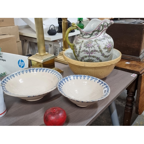 858 - A large Mason Cash style mixing bowl with two smaller spongeware fruit bowls. Also included is a lar... 