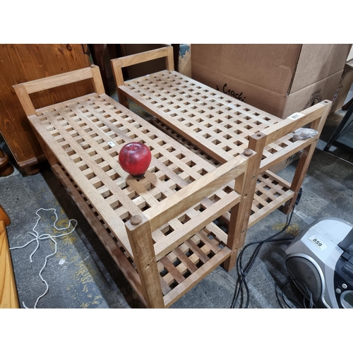 860 - Two wooden latticework shoe racks. Can be stacked on top of each other.