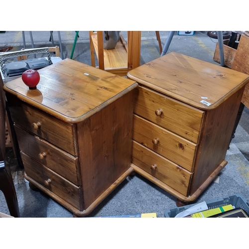 896 - A pair of pine bedside cabinets with three drawers. In good order.