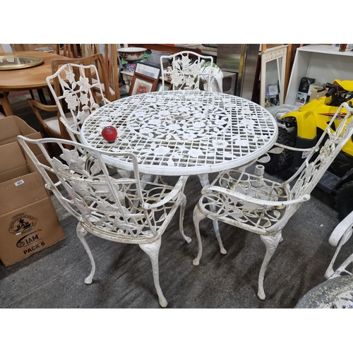 901 - Star Lot : A lovely vintage  five-piece garden suite comprising of a round metal table and four matc... 