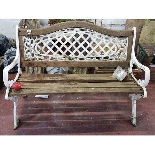 907 - A beautiful vintage wrought iron garden bench with lattice and foliate detailing to back and sides. ... 