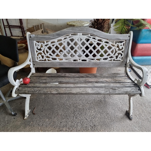 918 - A beautiful vintage wrought iron garden bench with lattice and foliate detailing to back and sides. ... 