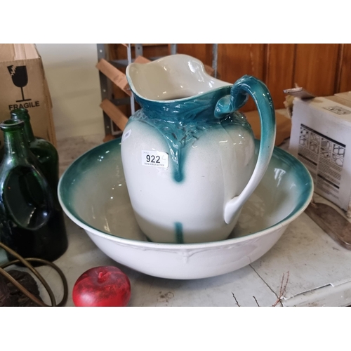 922 - A two-piece vintage wash stand set comprising of a basin and a matching water jug with turquoise det... 