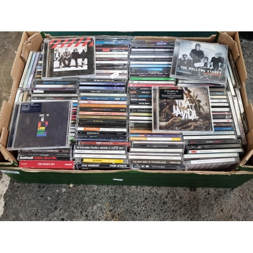 928 - A box with approx. 170 CD's including artists U2, Coldplay and The Rolling Stones.