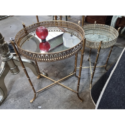 954 - A pair of graduating tray tables with brass frames and removable mirrored tray tops with pierced gal... 