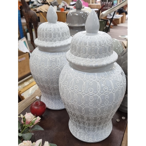 970 - Two large ceramic lidded urns. Glazed in a pale grey finish with interlocking pattern. Both in great... 