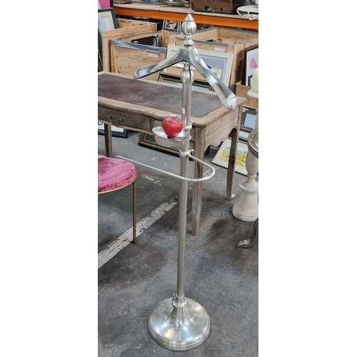 974 - A very heavy polished chrome valet stand. Designed in the traditional form with integrated clothes h... 