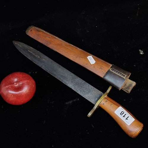 118 - A large vintage knife with a wooden sheath and handle with brass handgaurd and wooden handle.