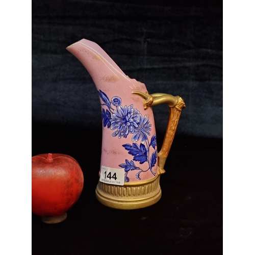 144 - Star lot : An unusual ceramic Tusk jug from Royal Worcester. With a handle in the shape of an antler... 