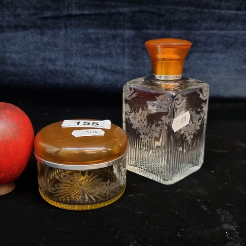 155 - Two vintage beauty product containers including perfume bottle and a cream jar. Both with orange lid... 