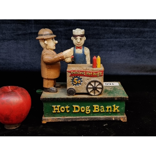 166 - A heavy cast metal money box in the form of a hot dog stand.  With articulated elements.