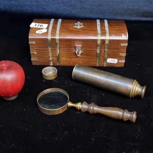 176 - A vintage traveller's set comprising of wooden box, telescope, magnifying glass and a compass.