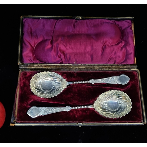 183 - A beautiful vintage pair of Robert Fead Mosley silver plated serving spoons boasting an intricate de... 