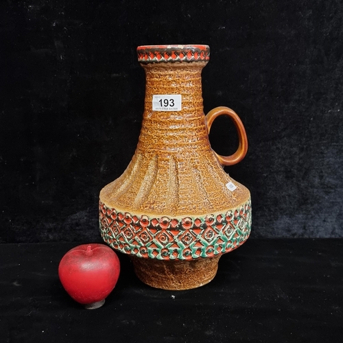 193 - A large vintage West German pottery vase by SPARA model 553/31. Designed in brown with red and blue ... 