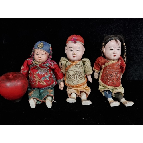 198 - A trio of antique papier-mâché Chinese dolls featuring muslin torso and silk garments. With handpain... 