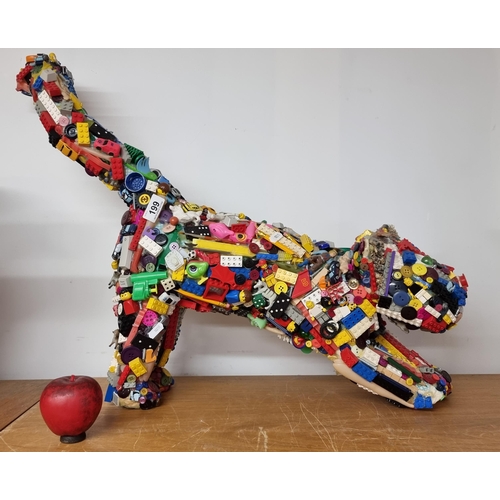 199 - A fabulous large stretching dog figure with mixed toy appliqués including Lego, model cars, buttons ... 