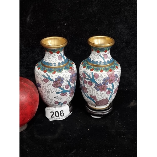 206 - A par of neat sized cloisonné bud vases. Both with a white enamel ground and cherry blossom motifs. ... 