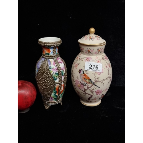 216 - Two ceramic vases including a Portuguese Ceramico Ibis lidded example and a second vase with metalwo... 