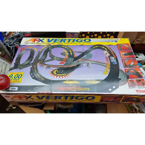424 - An AFX Vertigo race track by TOMY. Designed with 9metres of track. Released in 1996. With original b... 