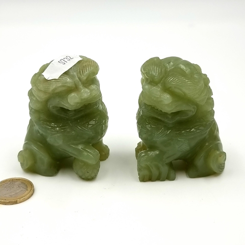 44 - Star Lot : A pair of antique hand carved Chinese jade  Foodog figural scroll weights. Featuring exce... 