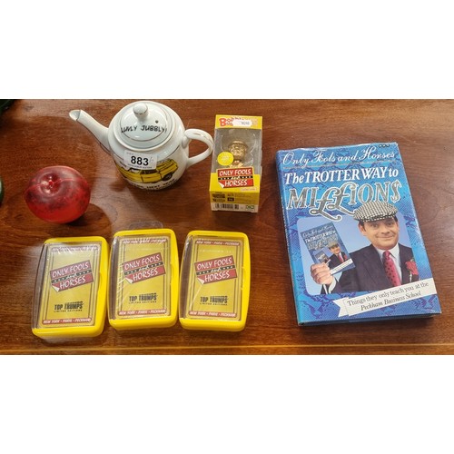 883 - Six collectable items from the comedy series 'Only Fools and Horses' including a book, a teapot, a b... 