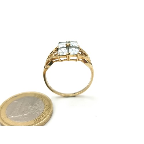 42 - Star Lot : A beautiful vintage 9 carat gold Aquamarine four stone ring, set with attractive floral C... 