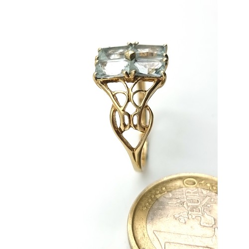 42 - Star Lot : A beautiful vintage 9 carat gold Aquamarine four stone ring, set with attractive floral C... 