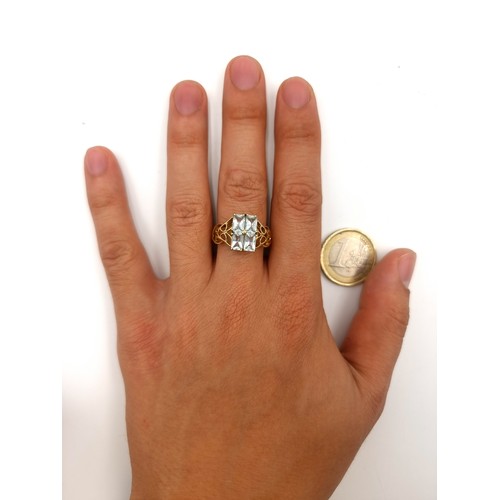 42 - Star Lot : A beautiful vintage 9 carat gold Aquamarine four stone ring, set with attractive floral C... 