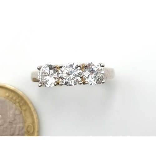 48 - A very attractive super sparkly three stone bright White Moissanite wide band ring. Unmarked, possib... 