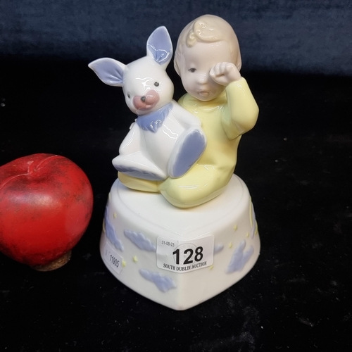 128 - An unusual Llardo nighttime music box of a baby and his bunny.