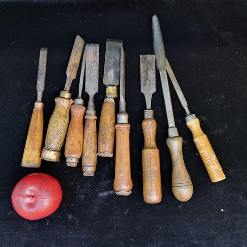 137 - A collection of eight vintage chisels most with brand names and another unusual item.