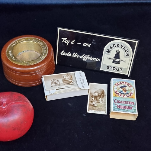 142 - Three unusual items including a shelf sign for Mackson Stout, an antique Hambury and Buxton barrel p... 