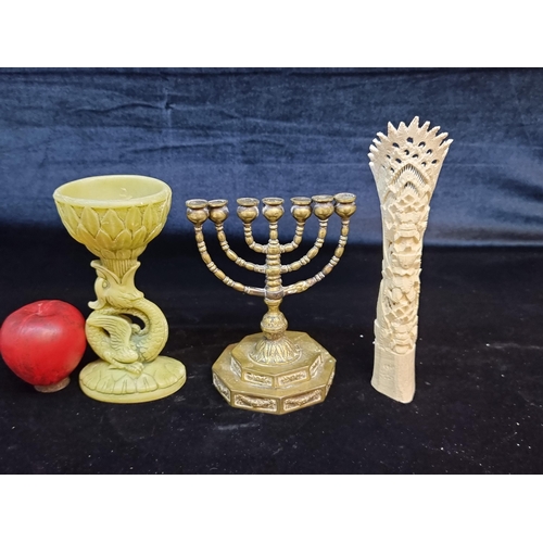 151 - A trio of vintage items including an Aztec bone carving, a brass menorah and a bowl in the form of a... 