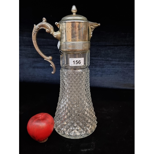 156 - An elegant vintage glass Sheratonn claret jug with a silver plated lid featuring a foliate handle. W... 