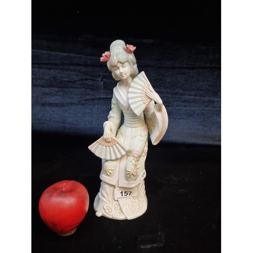 157 - A KPM Porcelain geisha figure with lovely floral detail. Featuring mark to base. With internet comps... 