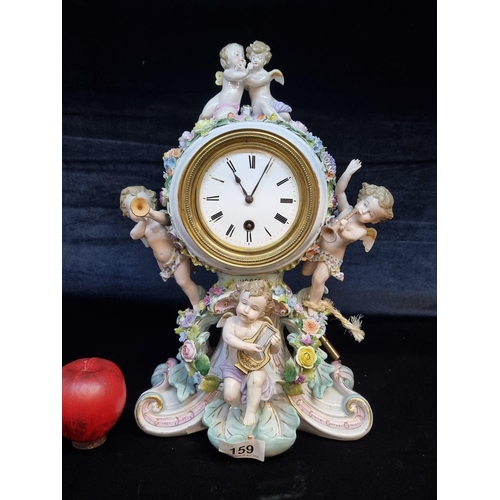 159 - Star Lot : A fabulous Antique porcelain French mantle clock with an ornate case featuring cherubs an... 