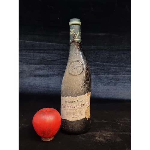 160 - A sealed 75cl bottle of La Fiole du Pape Chateauneuf-Du-Pape red wine. In an unusual asymmetrical bo... 