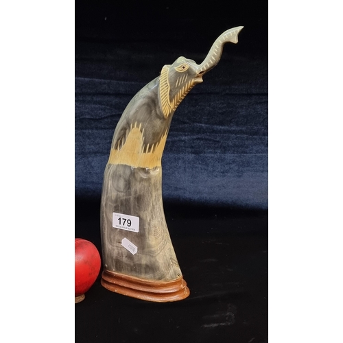 179 - A fabulous water-buffalo horn carving depicting an elephant with great detail to trunk and eyes. A t... 