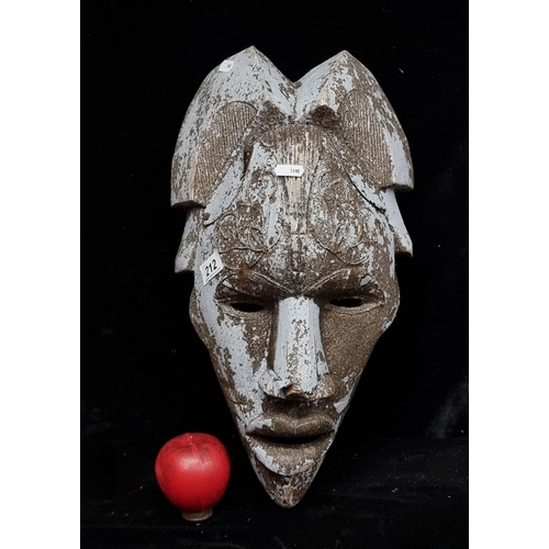 212 - A large very interesting carved African tribal mask.