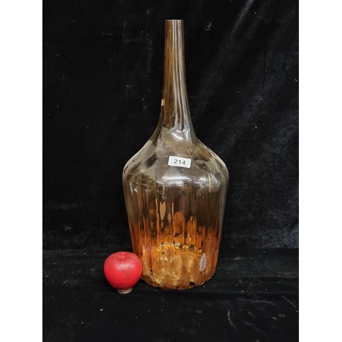 214 - A beautiful large vintage handblown honey glass bottle. A really stunning Mid Century piece with a l... 