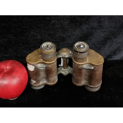 221 - A pair of World War 1 ear Carl Ziss Jena binoculars with brass and leather detail stamped C. Mitchel... 