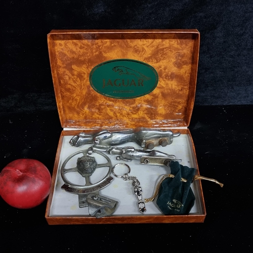 227 - A fabulous Jaguar box containing two car mascots, a miniature keyring and a rare vintage Jaguars dri... 