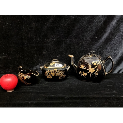 231 - A vintage oriental lacquer ware tea service with teapot, creamer and sugar bowl which has been repai... 