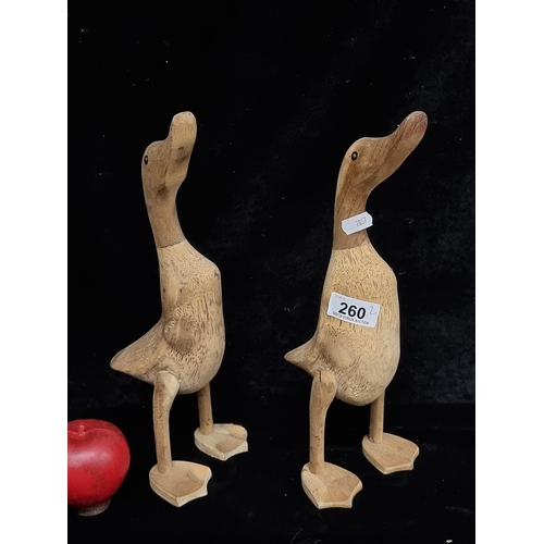 260 - A pair of charming wooden carved duck figures.