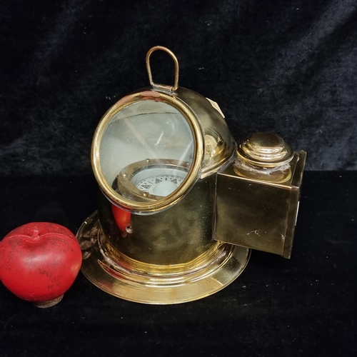 279 - A ship binnacle with a compass housed in a brass case with a moving display for easy reading during ... 